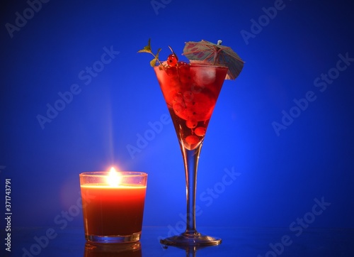 an evening cocktail. fruit evening cocktail, cocktail by candlelight