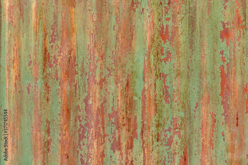 Grunge old rusty background. Wavy metal surface.