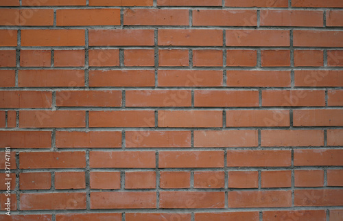 brick red wall. background of a brick house