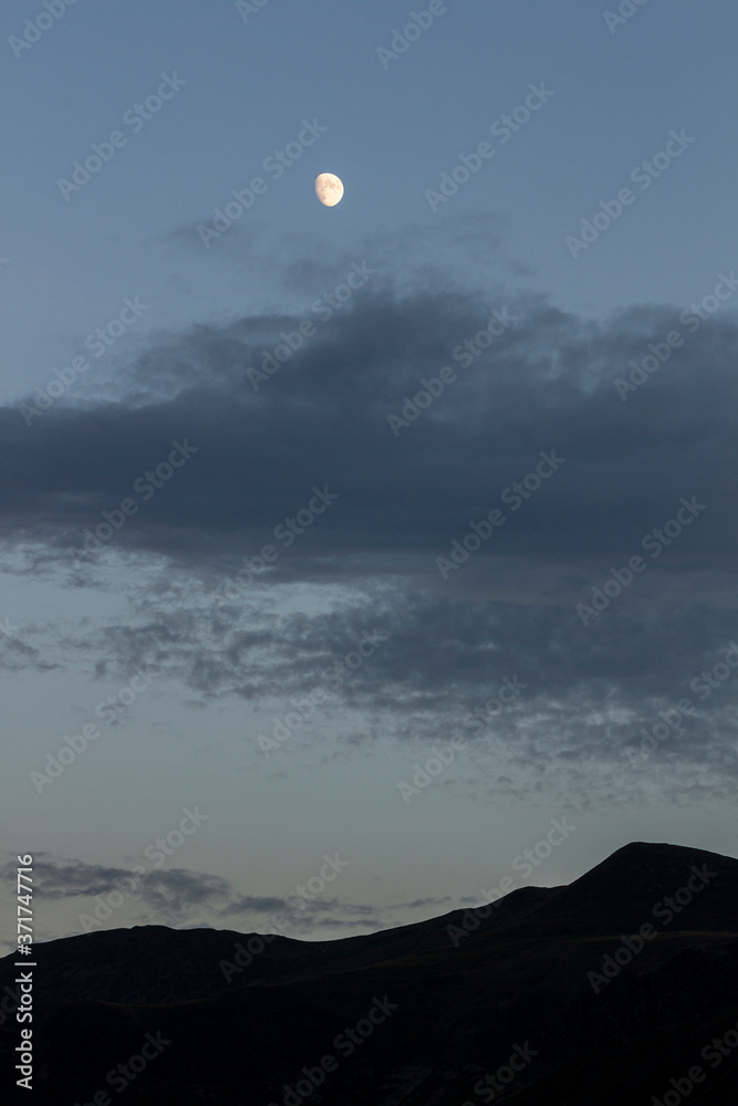 Moon next to the mountain in the Picos de Europa Moon next to the mountain in the Picos de Europa