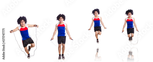 Guy jumps with skipping rope isolated on white