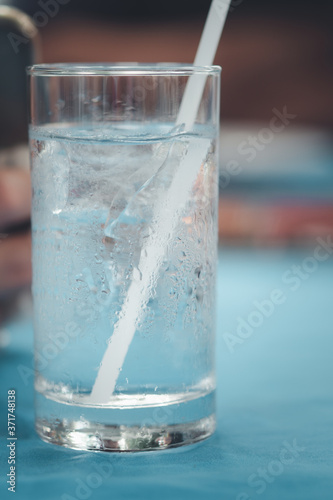 Water in a glass, selective focus