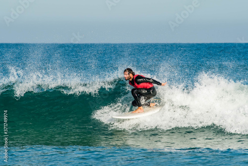 Photography surfer in action in the waves