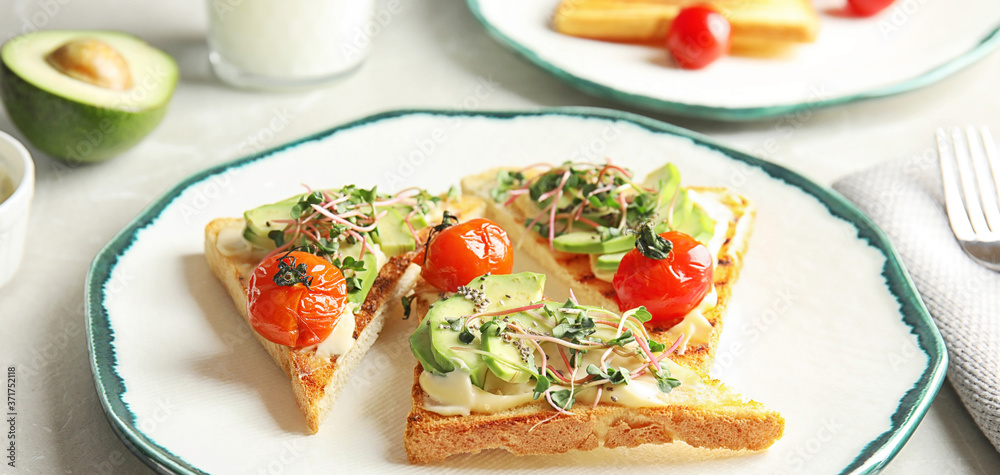 Tasty bruschettas with avocado, tomatoes and chia seeds on plate, banner design