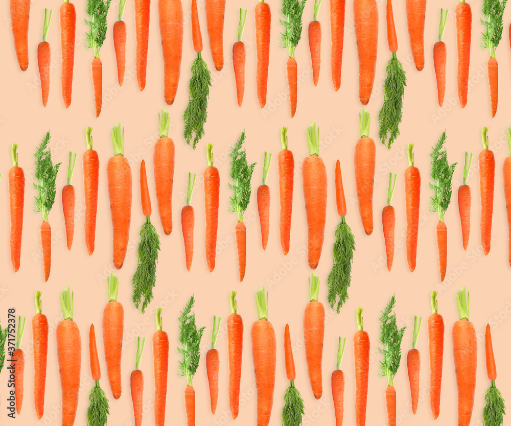 Whole carrots on beige background. Pattern design