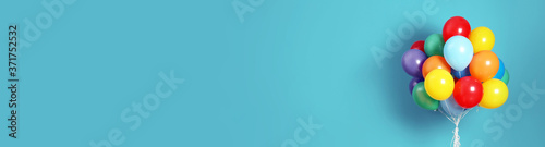 Wallpaper Mural Bunch of bright balloons on light blue background, space for text. Banner design Torontodigital.ca