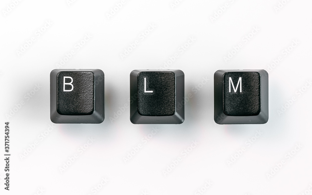 Computer keyboard keys spelling BLM, isolated on white background