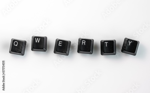 Computer keyboard keys spelling QWERTY, isolated on white background