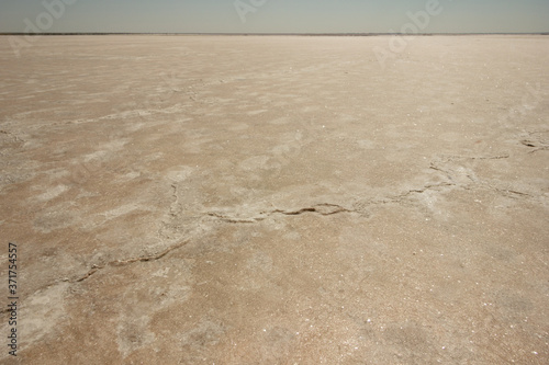 Close-up of sand on the beach of the salty pink lake Bursol  Altai Territory .
