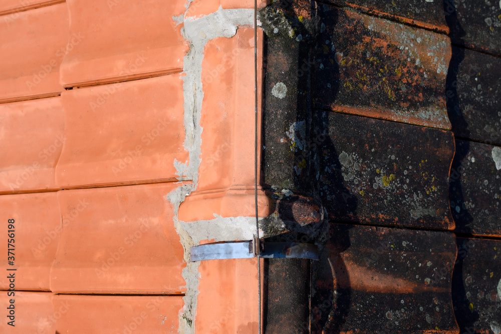 Same roof tiles before and after washing with compressed water. Half of job done. Cleaned dirt and lichens. Same roof tiles before and after washing with compressed water. Half of job done. Cleaned dirt and lichens.