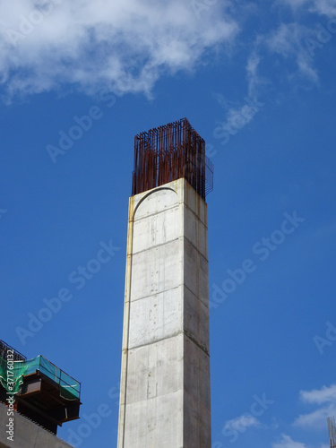 SEREMBAN, MALAYSIA -MARCH 7, 2020: Steel reinforced concrete column under construction. Reinforcement bar on top of column ready for the next stage of construction.