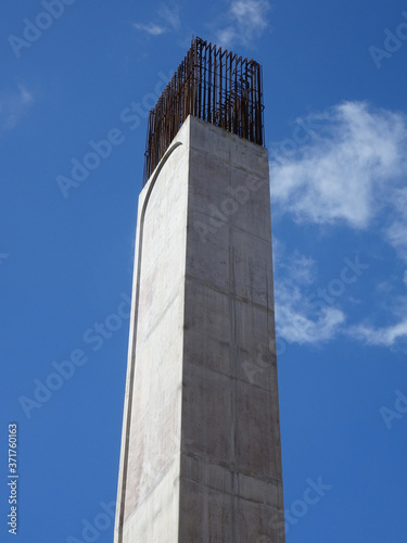 SEREMBAN, MALAYSIA -MARCH 7, 2020: Steel reinforced concrete column under construction. Reinforcement bar on top of column ready for the next stage of construction.