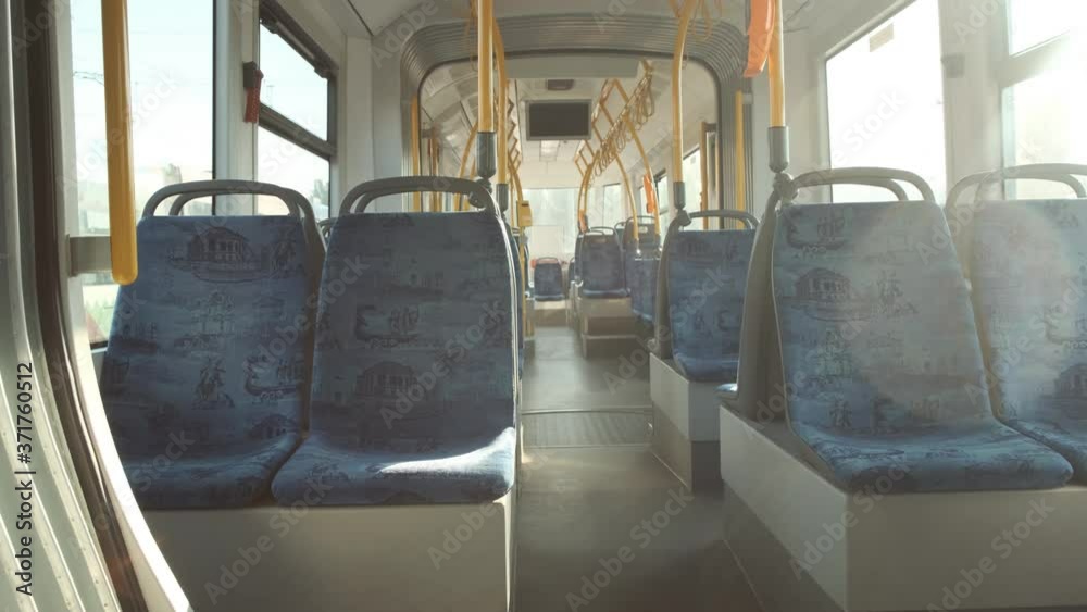 Blue color of seats in an empty bus during quarantine. Coronavirus COVID 19 in public transport. Interior of a bus 4k