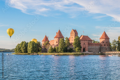 TRAKAI/LITHUANIA: 09/07/2019: Colorful Landscape of Trakai Historical National Park, UNESCO world heritage site, on beautiful summer day. Trakai Island Castle, reflecting in clear water of Galve lake.