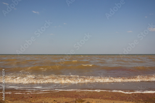 Close-up of sand on the beach and water of the Yarovoe salt lake  Altai Territory .