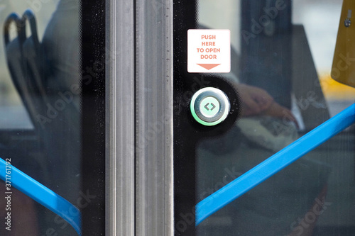 Open the door. Green button for opening doors in the subway and bus. Button to stop transport. Push here to open door