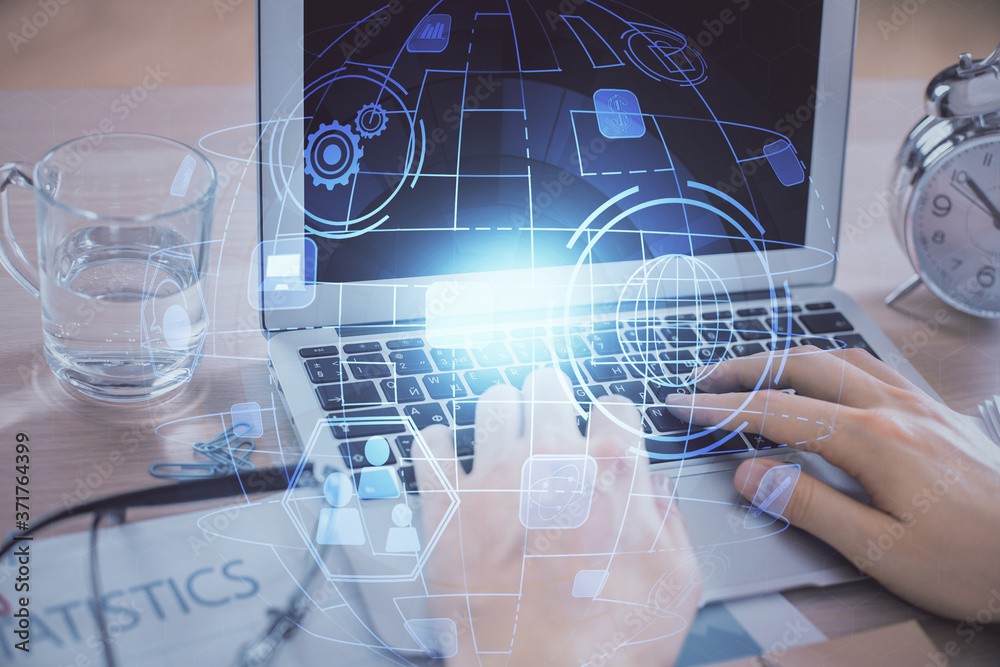 © peshkova - Social network theme hologram with businessman working on computer on background. Concept of world wide web. Double exposure.