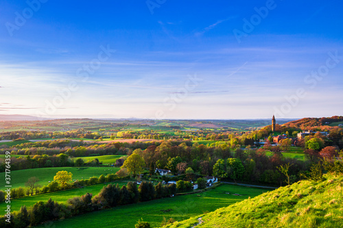 View of Abberley clock tower at sunset during late April from Walsgrove hill near Great Witley in Worcestershire west midlands England