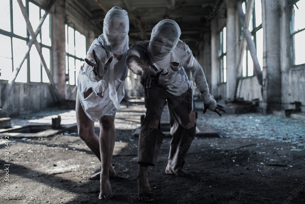 Dirty monsters boy and girl with bandaged faces Dirty monsters boy and girl with bandaged faces