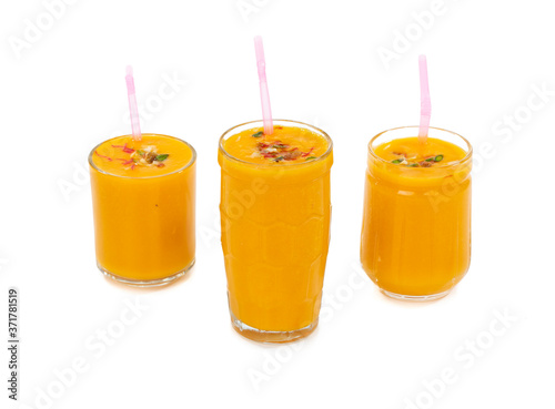Fresh mango fruit juice on white background