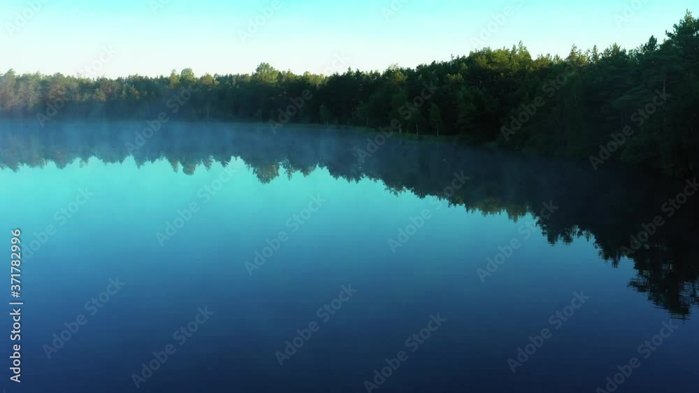 Foggy morning on a lake during sunrise. Sunrise on the lake, 4K aerial view of morning mist at sunrise, morning mist on the lake, Aerial view of mystical lake at sunrise with fog Foggy morning on a lake during sunrise. Sunrise on the lake, 4K aerial view of morning mist at sunrise, morning mist on the lake, Aerial view of mystical lake at sunrise with fog
