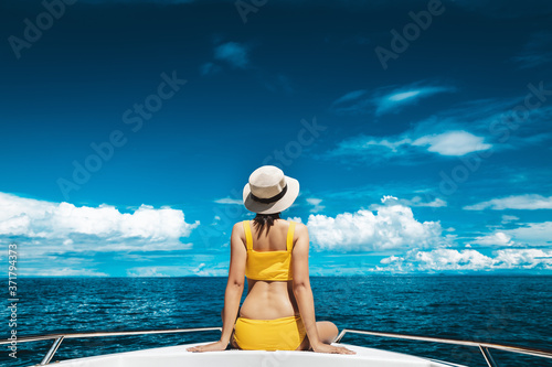 Traveler asian bikini woman relax and travel in boat on sea Phuket Thailand
