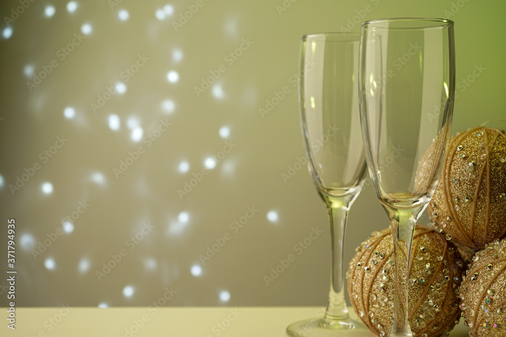 glass glasses for sparkling champagne close up on green background with flickering lights in bokeh glass glasses for sparkling champagne close up on green background with flickering lights in bokeh