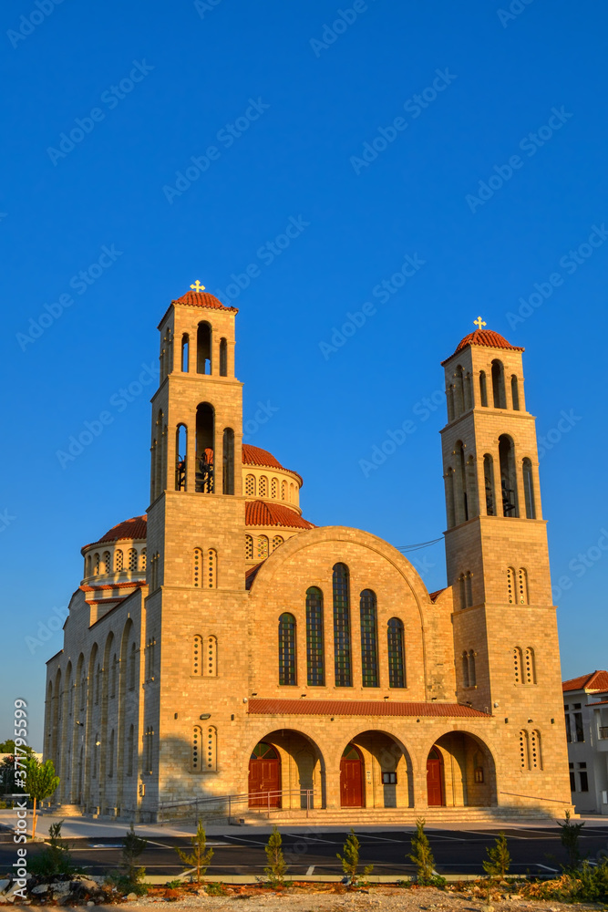 Agioi Anargyroi Orthodox Cathedral in Paphos, Cyprus. View of the church in the sun at sunset.