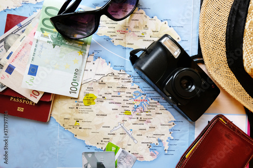 Travel accessories, map on a wooden table, journey