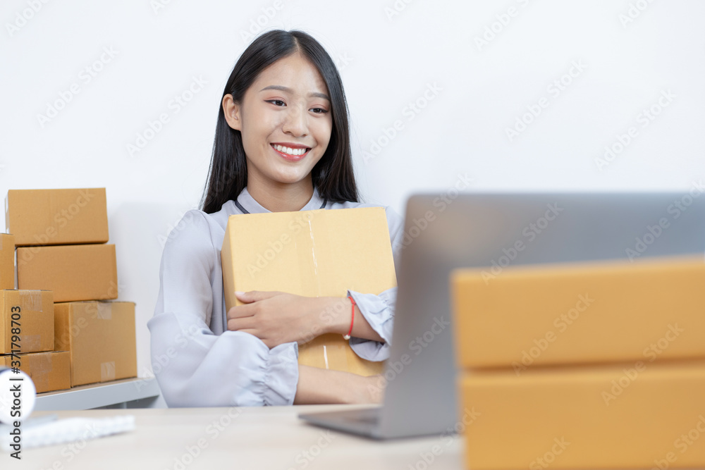 Young Asian woman taking a selfie to verify her online shipping identity. Young Asian woman taking a selfie to verify her online shipping identity.