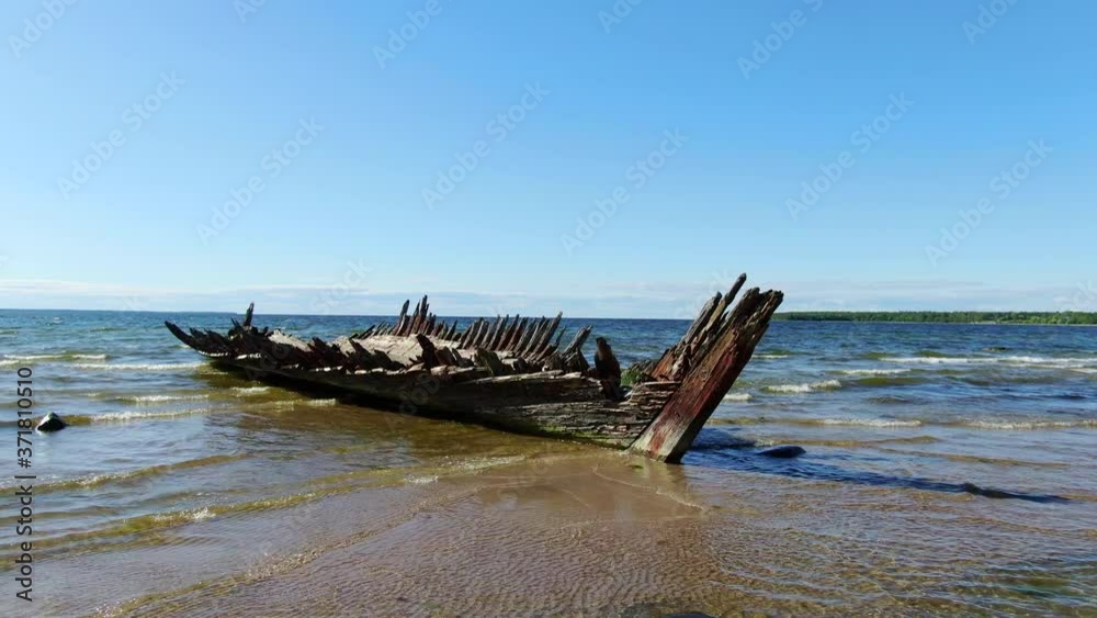erial view of old abandoned wooden ship wreck at the beach. Wreckage of schooner Raketa near a shore erial view of old abandoned wooden ship wreck at the beach. Wreckage of schooner Raketa near a shore