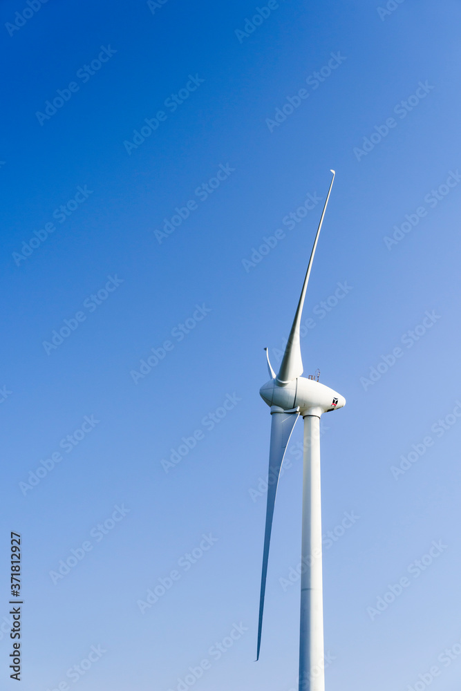 Close-up of windmills group with blue sky, on the west coast of Taiwan. Close-up of windmills group with blue sky, on the west coast of Taiwan.
