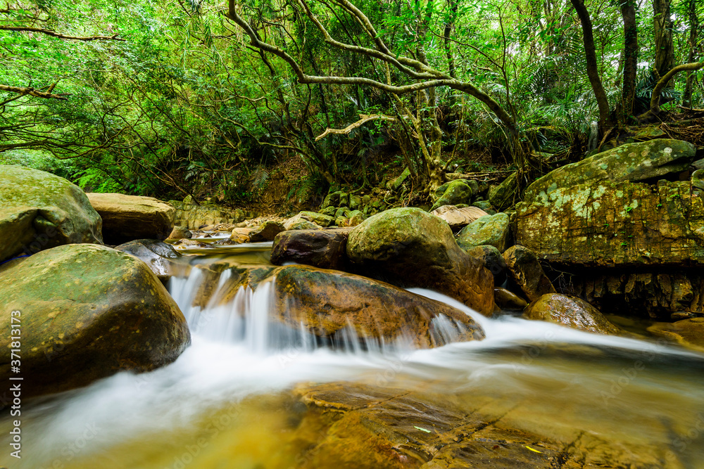 The stone under the waterfall, close-up as background. New Taipei, Taiwan.