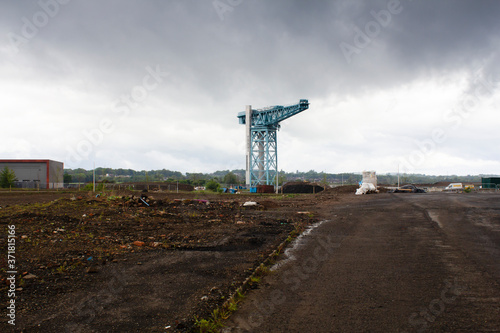 A lone crane on the banks of the Clyde near Glasgow on a sprng morning.
