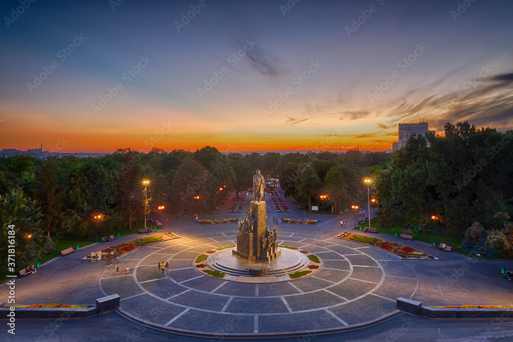 Shevchenko park of Kharkiv in sunset colors and evening lights, Ukraine
