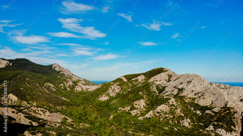 The mountains and hills of the Crimea view from quadcopter of the forest and the sky