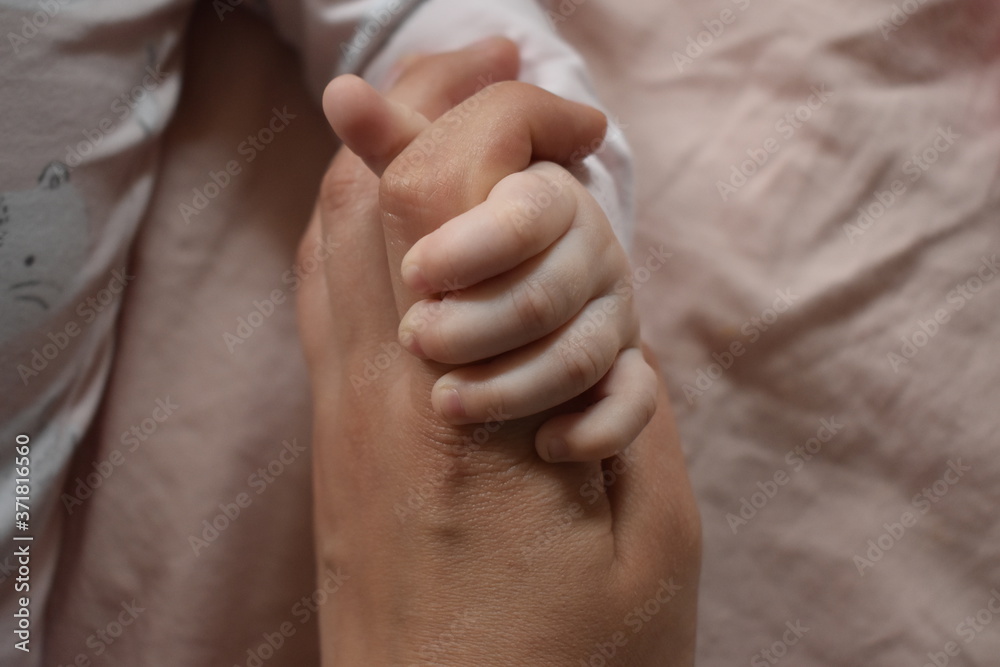Fototapeta premium Babys and moms hands