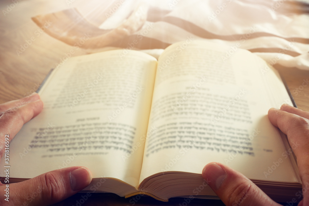 religion image of Prayer book and Shofar (horn) jewish religious symbols. Rosh hashanah (jewish New Year holiday), Shabbat and Yom kippur concept religion image of Prayer book and Shofar (horn) jewish religious symbols. Rosh hashanah (jewish New Year holiday), Shabbat and Yom kippur concept