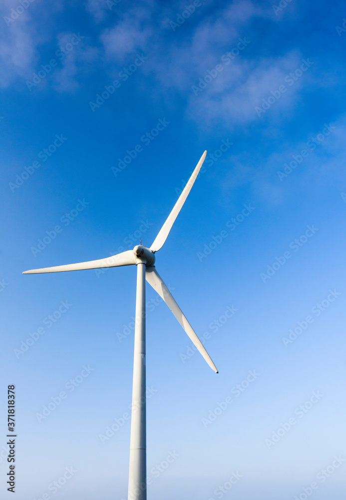 Close-up of windmills group with blue sky, on the west coast of Taiwan. Close-up of windmills group with blue sky, on the west coast of Taiwan.