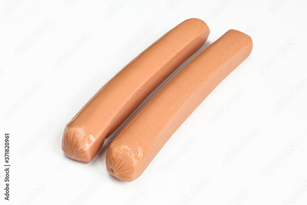 Fresh uncooked sausages isolated on white background. Hot dogs made of chicken meat Fresh uncooked sausages isolated on white background. Hot dogs made of chicken meat
