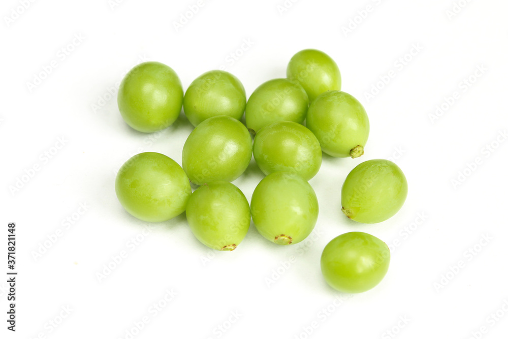 Pile of green unripe grape beans isolated on white background. Organic fruit Pile of green unripe grape beans isolated on white background. Organic fruit