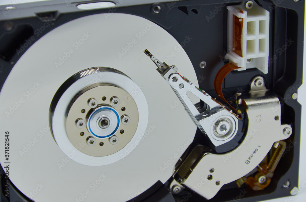 Computer hard drive and a stethoscope. Components for PC. Open hard disk storage. Recovery and storage of information. Magnetic disks inside HDD. Modern digital technology. Computer hard drive and a stethoscope. Components for PC. Open hard disk storage. Recovery and storage of information. Magnetic disks inside HDD. Modern digital technology.