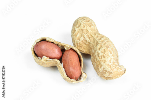 Peanuts in shell and peeled isolated on white background. Closeup and separated