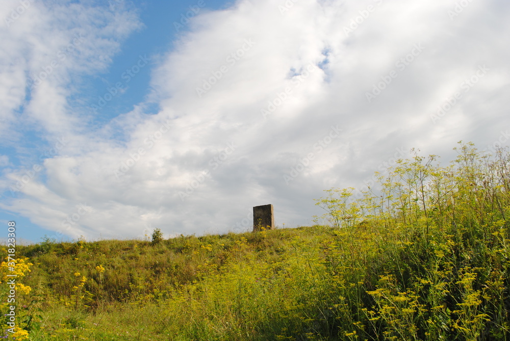 rural landscape with mystical slab and clouds rural landscape with mystical slab and clouds