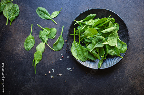 spinach green juicy leaves organic salad serving portion size natural product top view place for text copy space keto or paleo diet raw