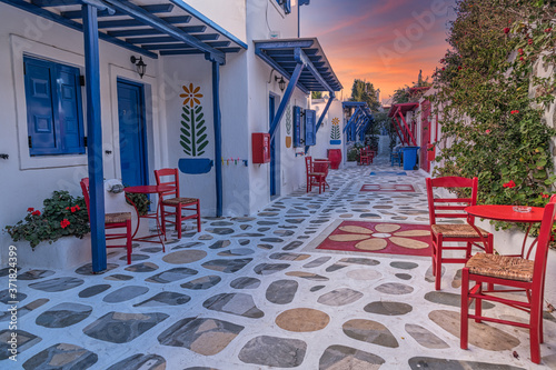 Fototapeta Naklejka Na Ścianę i Meble -  Greece, Mykonos, a fully colored and decorared typical house with bougainvillea in Ano Mera area 