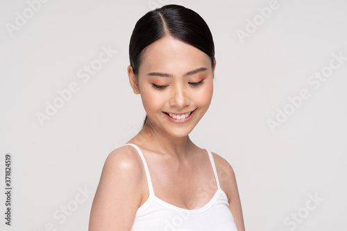 Beautiful Asian young woman smile with clean and fresh skin