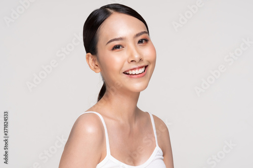 Beautiful Asian young woman smile with clean and fresh skin