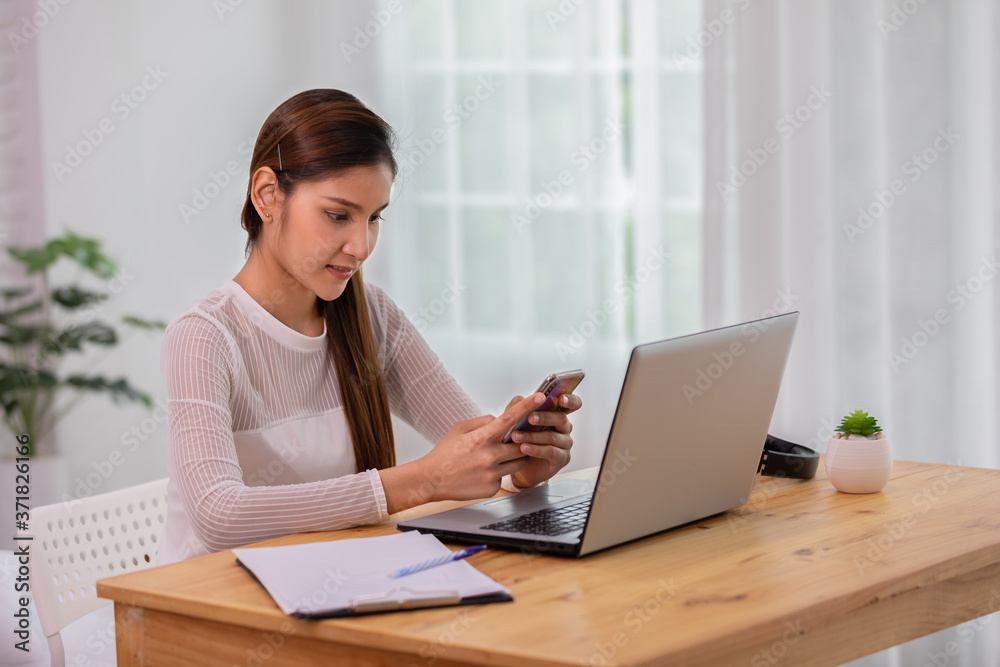 Beautiful Attractive indian Asian business woman using smartphone for shopping online and using social media at home Beautiful Attractive indian Asian business woman using smartphone for shopping online and using social media at home