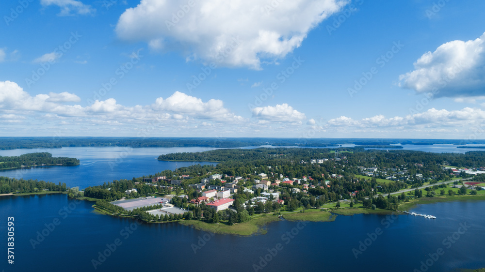 Aerial birds eye view of the Ikaalinen city at sunny summer day in Finland. Aerial panoramic cityscape.